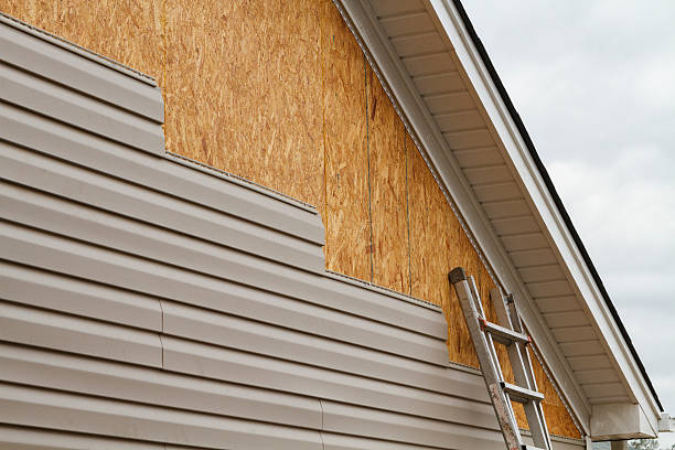 Professional Storm Damage Siding Repair technician working in Pleasantville, OH